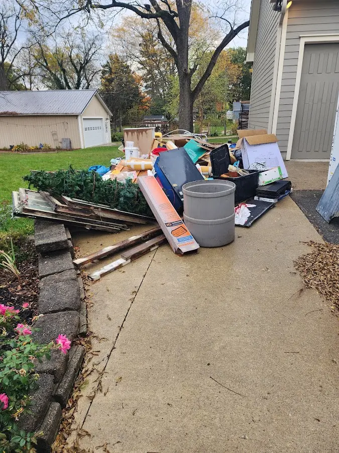 Dumpster being loaded with debris for 30 Yard Dumpster Rental in Penn Yan